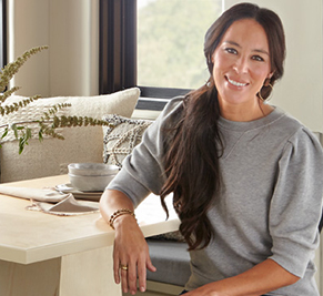 Joanna Gaines sitting at a table