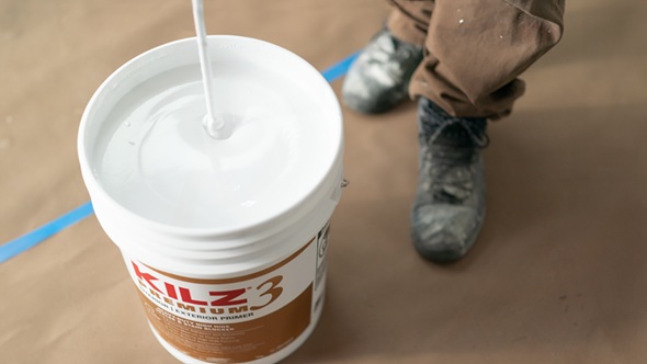 5 gallon bucket of Kilz Primer getting mixed