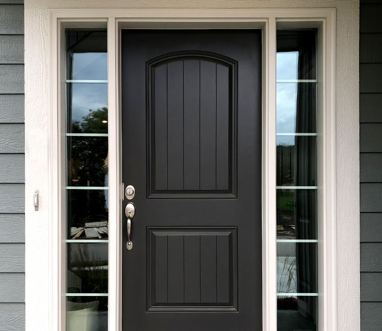 Front door painted in black paint
