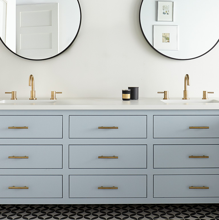 Bathroom with light blue cabinets