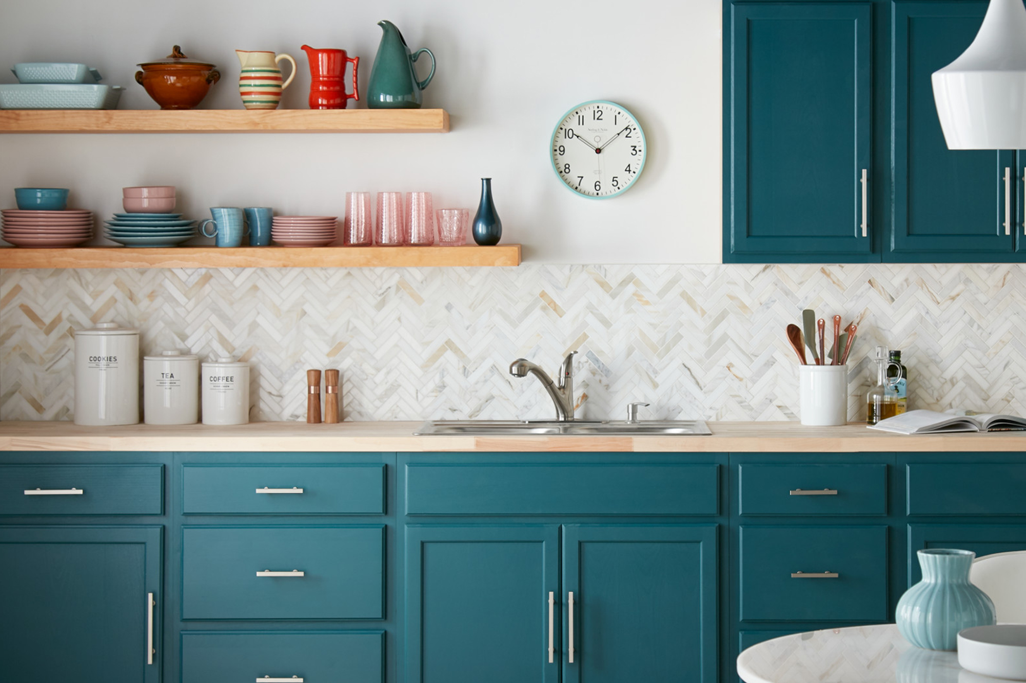 Kitchen with blue-green cabinets