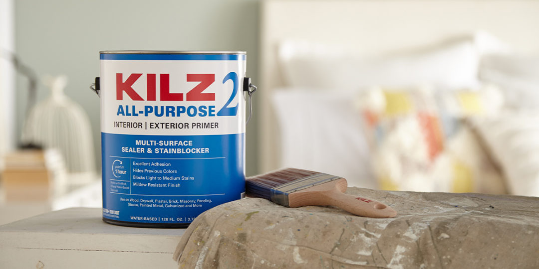Bucket of Kilz 2 All-Purpose Interior and Exterior Primer and a paintbrush