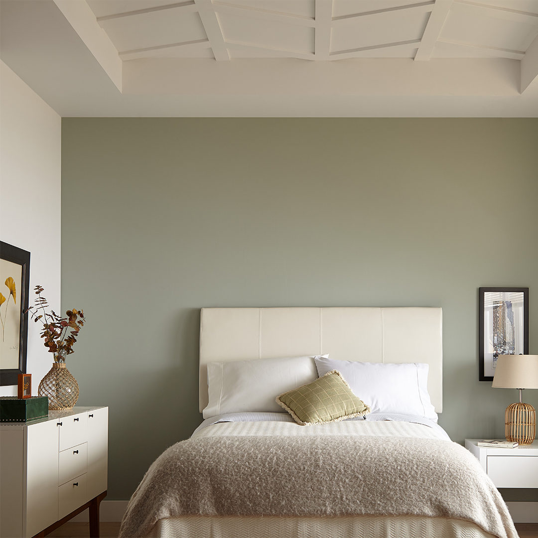 Bedroom with olive green accent wall