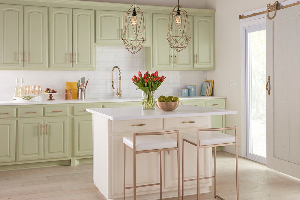 White kitchen with light green cabinets