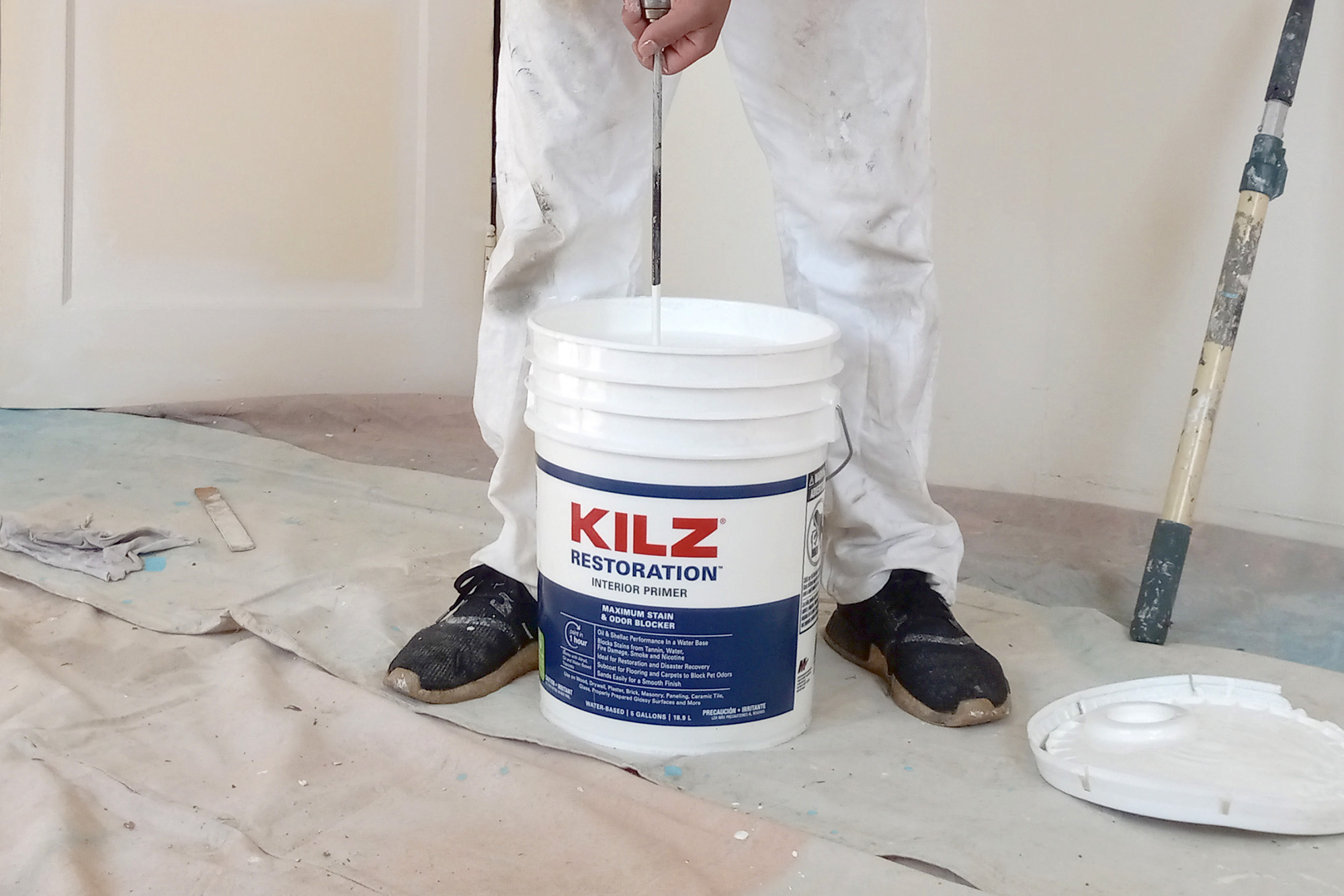 Image of 5-gallon KILZ RESTORATION Primer on job site.