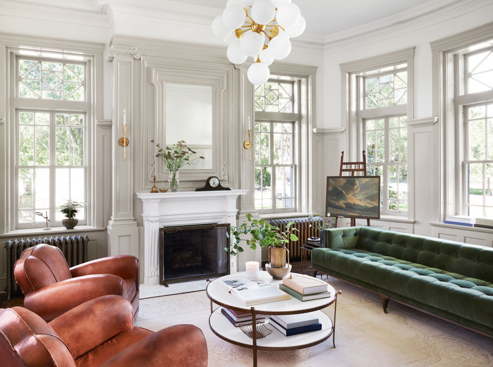 Wide view of the drawing room, showing the fireplace and wall molding and window trim using Magnolia Home by Joanna Gaines paint, using Castle Collection color Drawing Room.