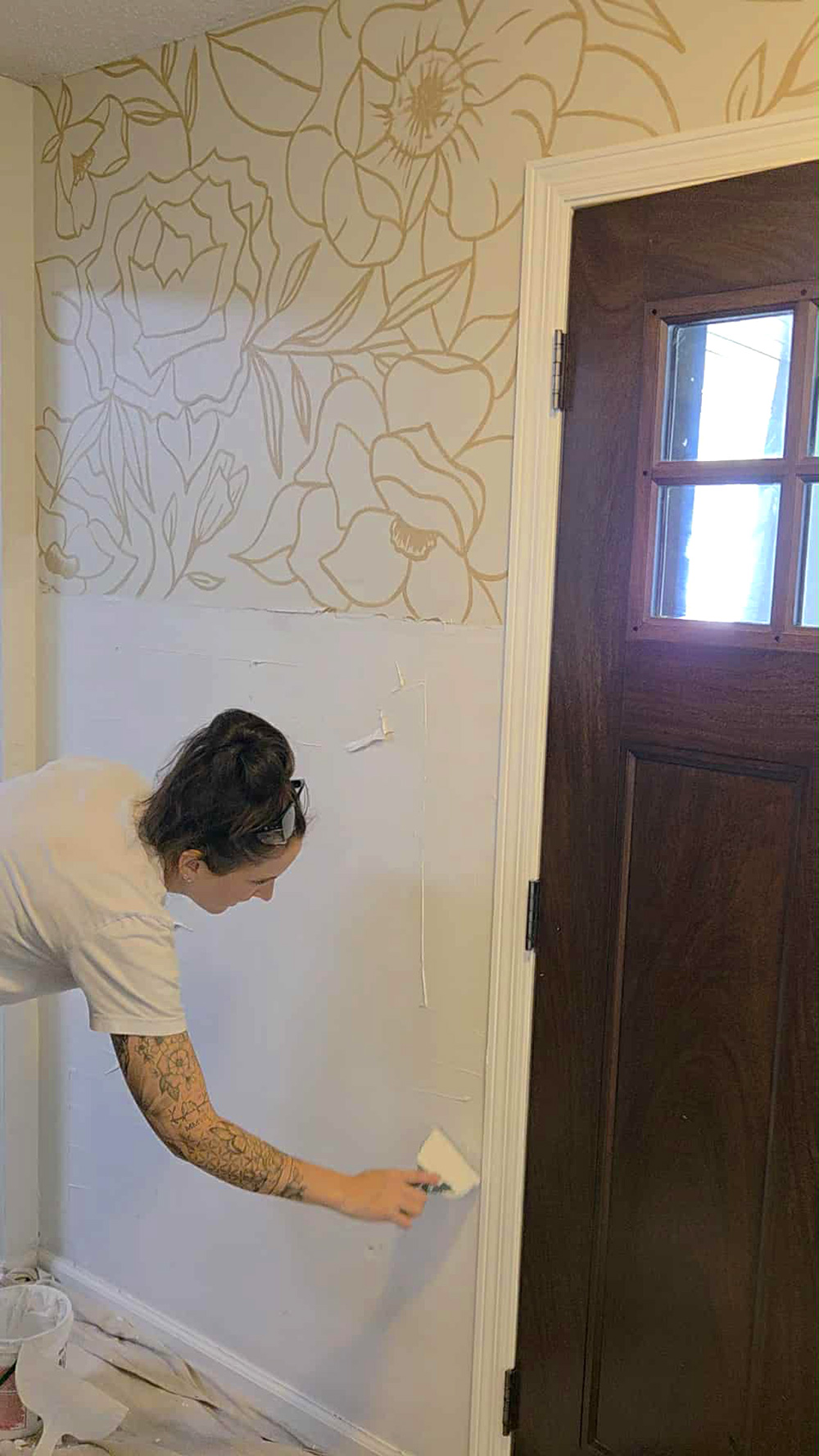 Sarah Berg prepping her walls before priming