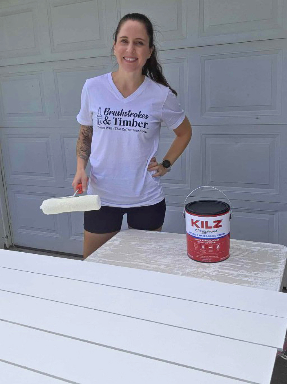 Sarah Berg with a can of KILZ Original Water-Based Primer